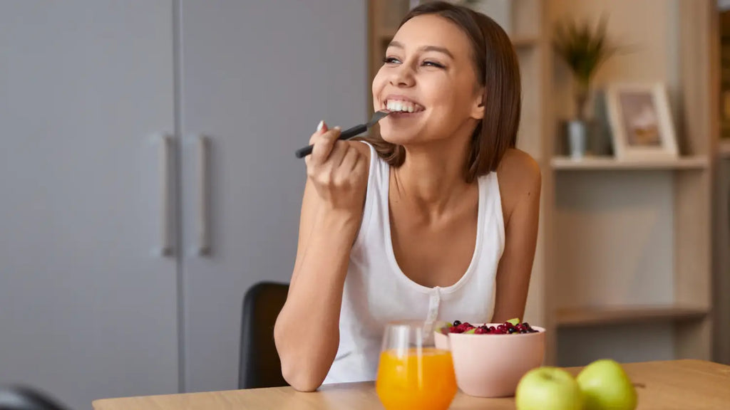Woman eating healthy and smiling