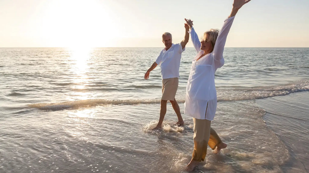 Senior couple taking a walk on the beach