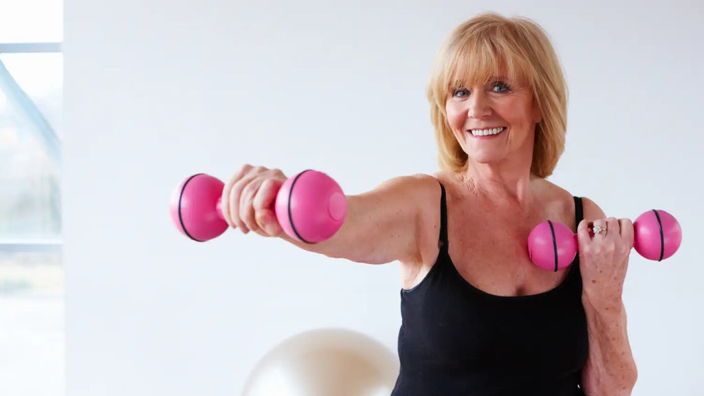 Senior woman working out with dumbells