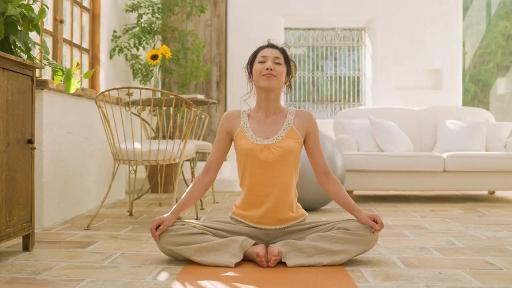 Woman meditating at home