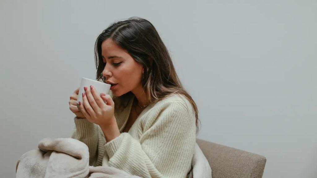 Woman peacefully drinking coffee