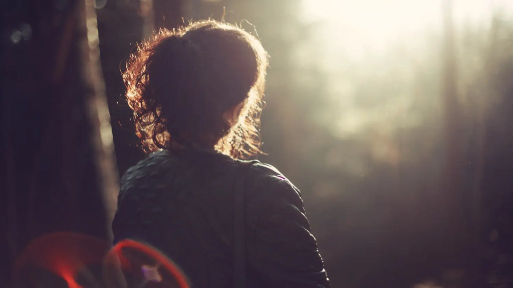 Woman walking in forest