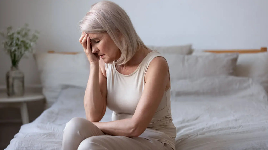 Middle age woman struggling with menopause symptoms