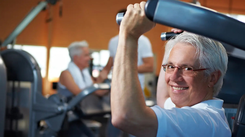 Senior man working out at the gym