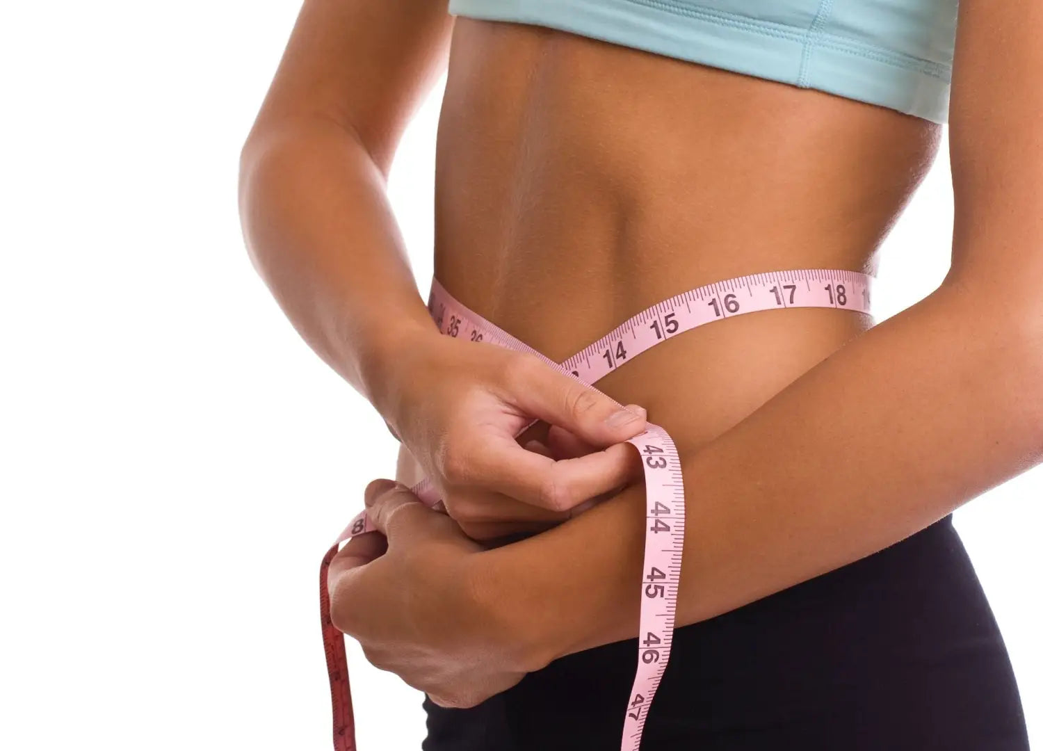 Woman measuring her waist