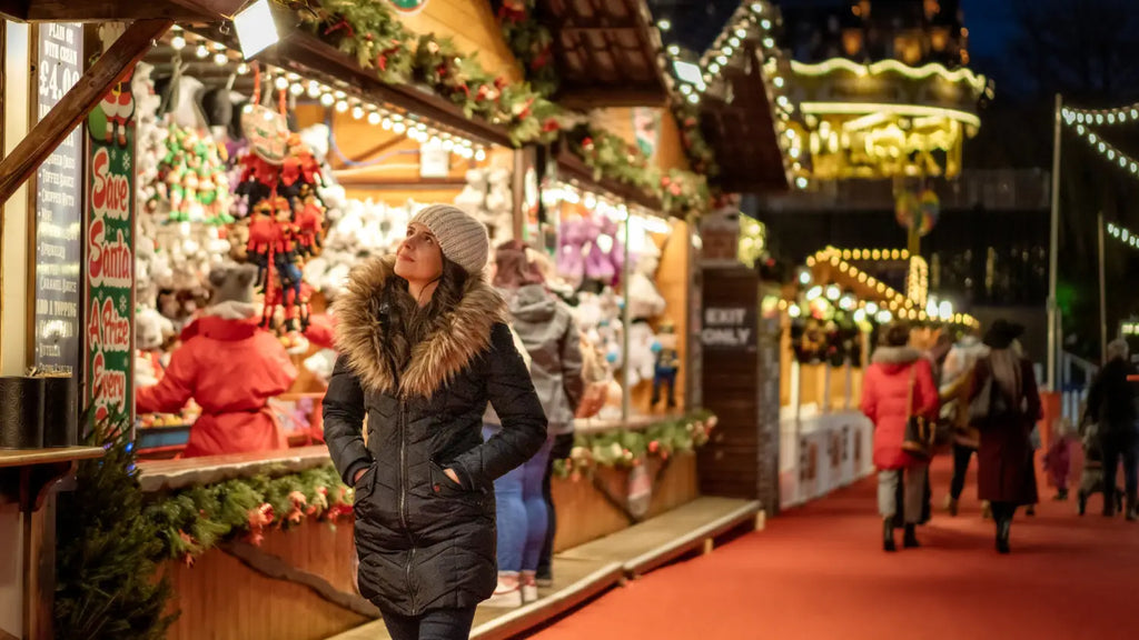 Woman walking through christmas market