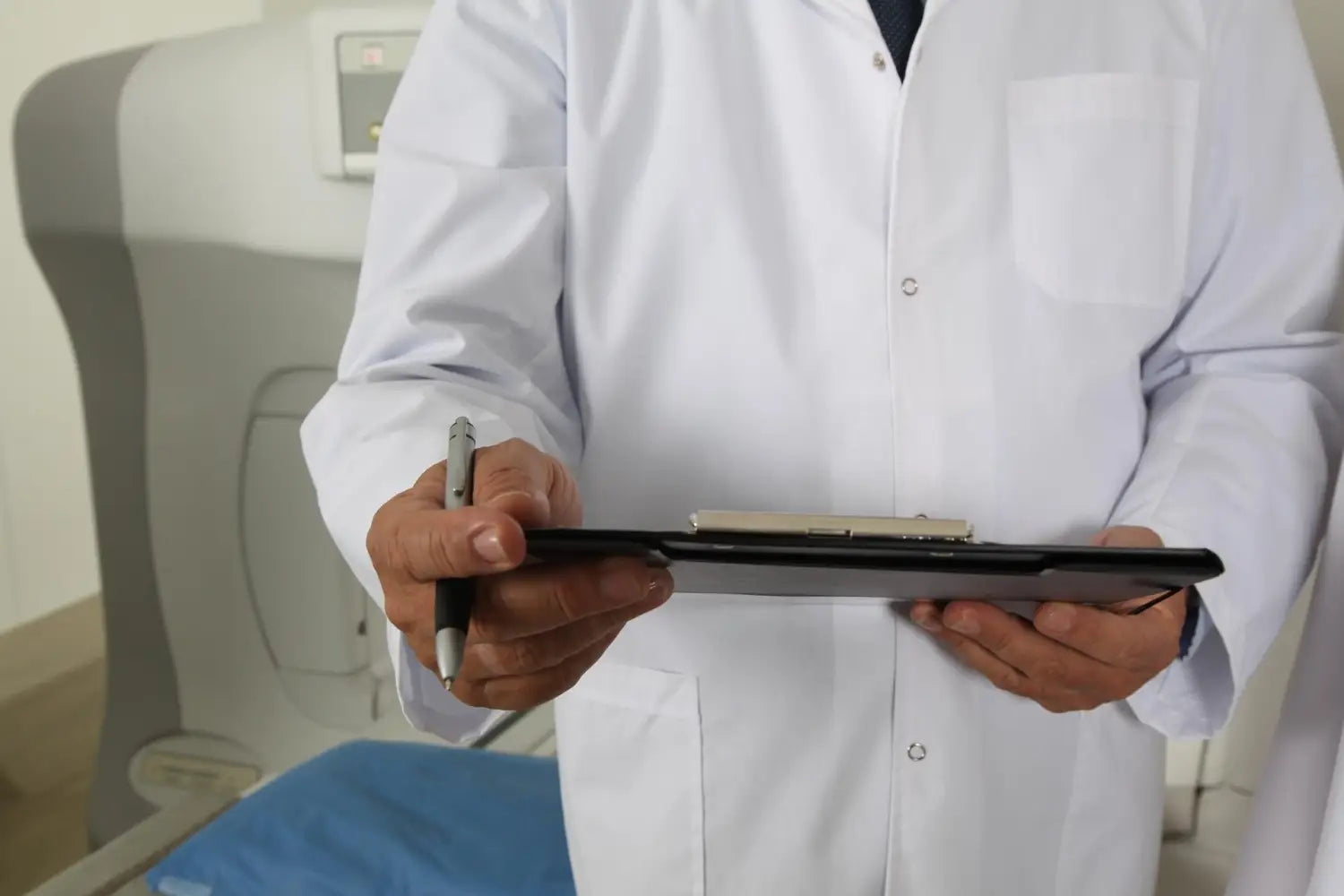 Healthcare professional holding a tablet.