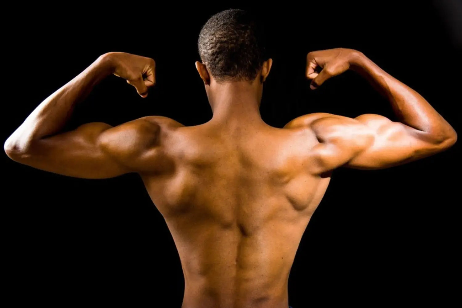 Man flexing back muscles and biceps.