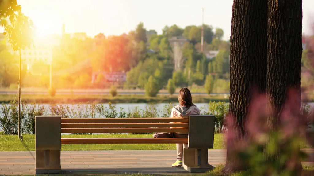 Woman sitting on park bench