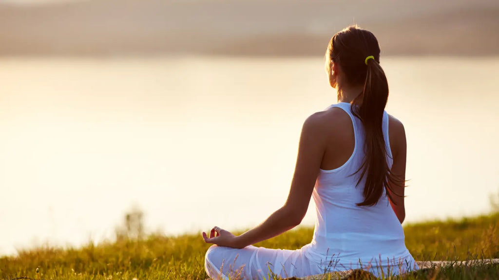 Woman meditating outdoors