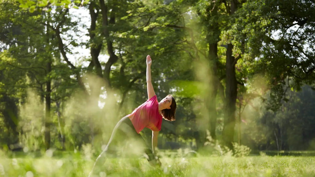 Woman practicing yoga outdoors