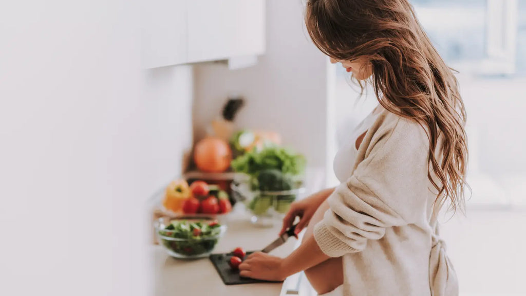 Woman cooking, chopping vegetables