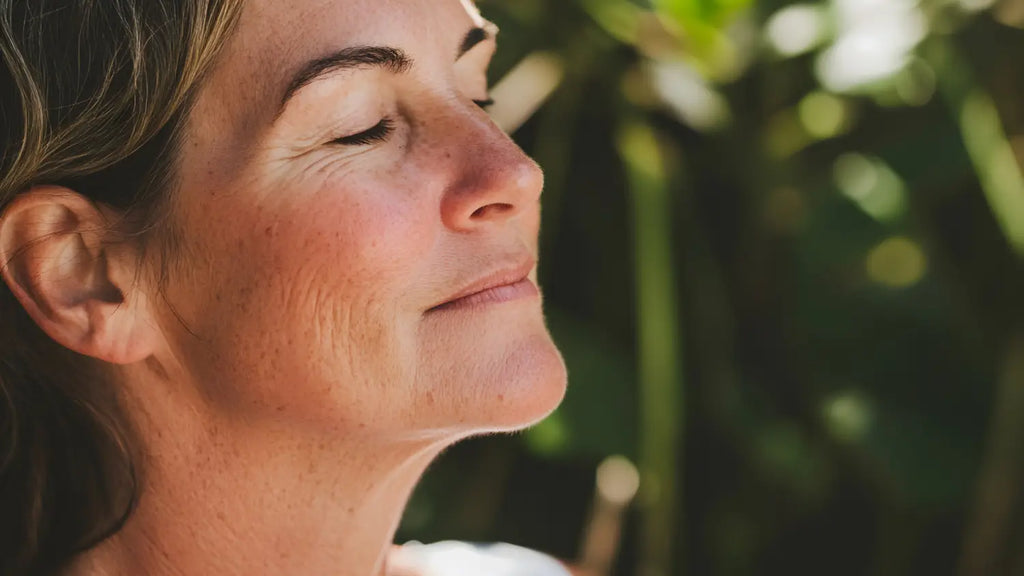 Woman smiling with eyes closed