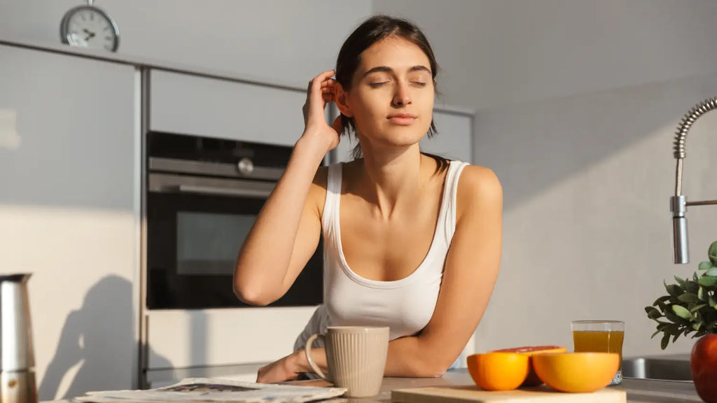 Woman leaning on kitchen counter