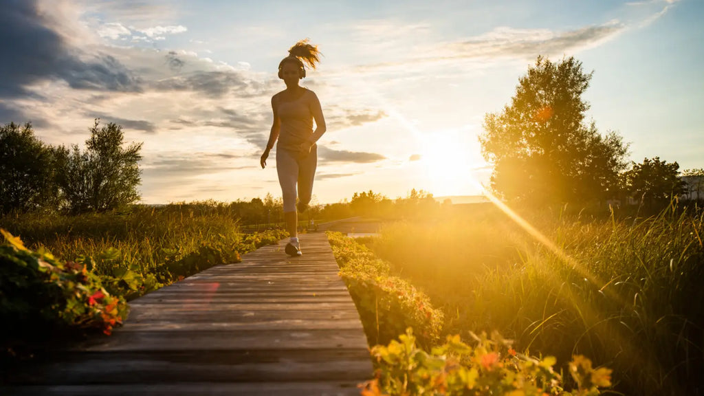 Woman running during sunset