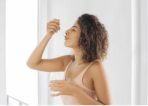 Woman eating yogurt.