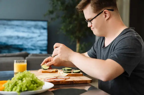 Man with Down syndrome having a meal.