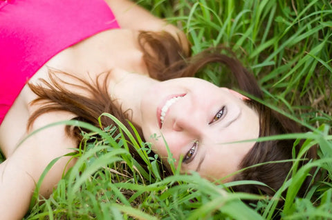 woman lying on grass