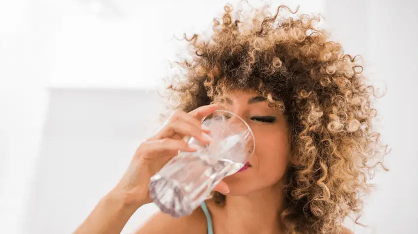 Woman drinking glass of water