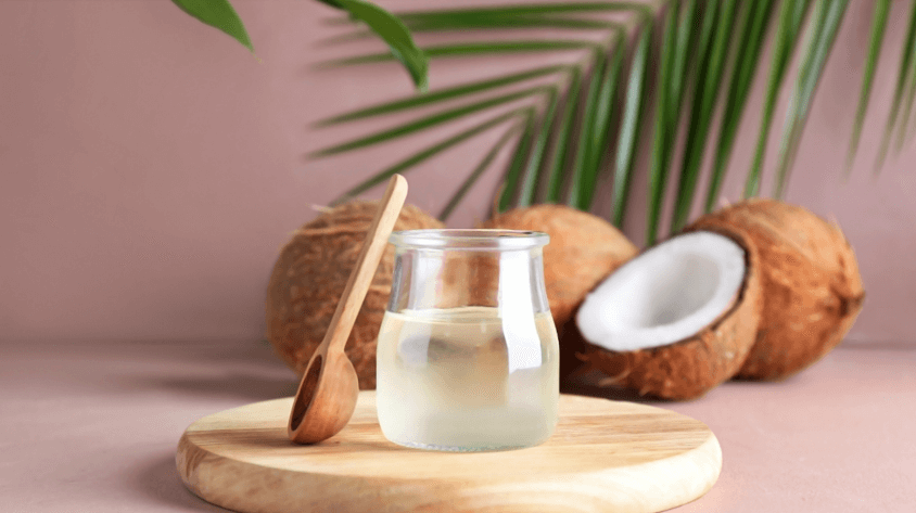 Jar of coconut oil and coconuts