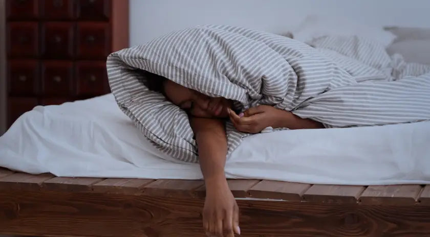 Woman sleeping covered with blanket