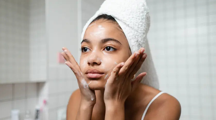 Woman washing her face