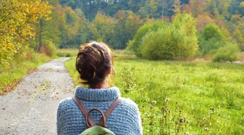 Woman taking walk outside during spring