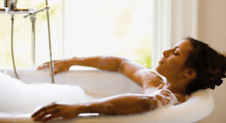 Woman relaxing in bath