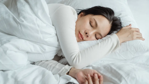 Woman sleeping on a bed