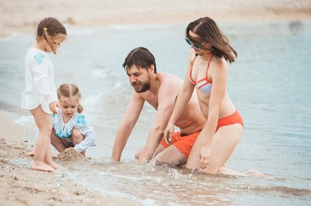 Family playing in the beach