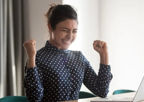 Woman celebrating a work achievement.