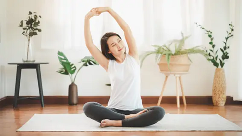 Woman stretching on a yoga mat