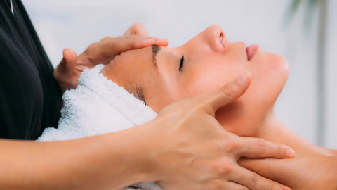 Woman receiving a facial massage