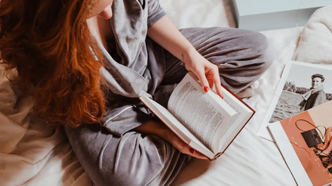 Woman reading in bed