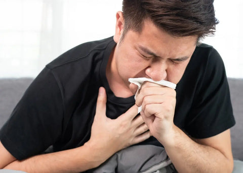 Man coughing