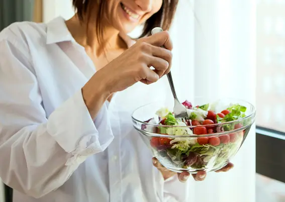 Woman eating healthy salad