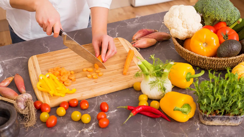 Woman chopping vegetables