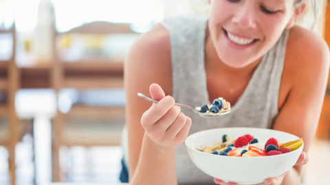 Woman wating yoghurt bowl