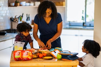 Mom cooking near her kids