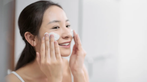 Woman washing her face