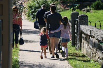 Mother taking a walk with her kids