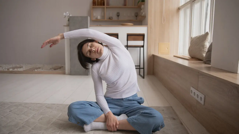 Woman stretching at home