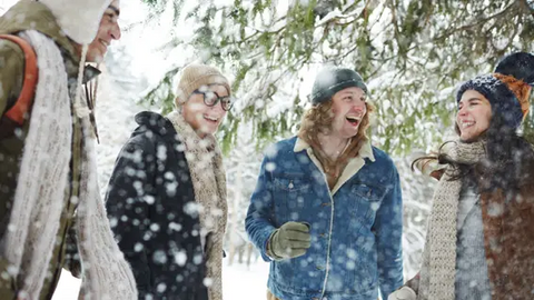 Friends laughing in the snow