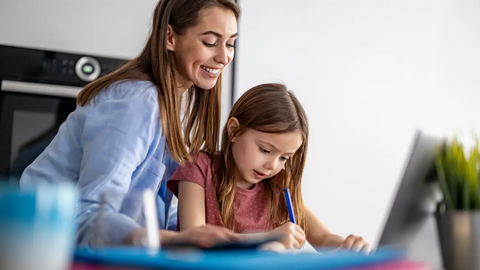 Mom helping daughter with homework