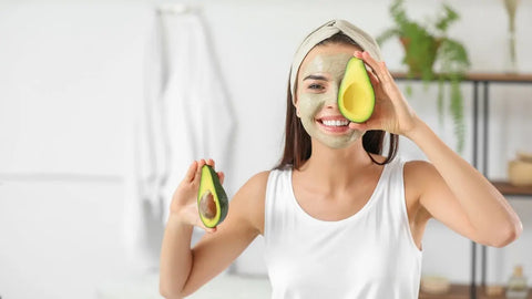 Woman with avocado mask on her face