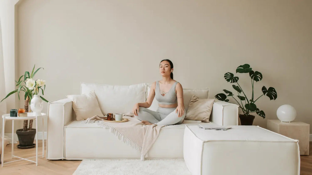Woman meditating in couch