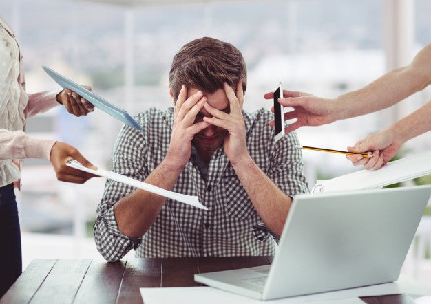 Man looking stressed at work