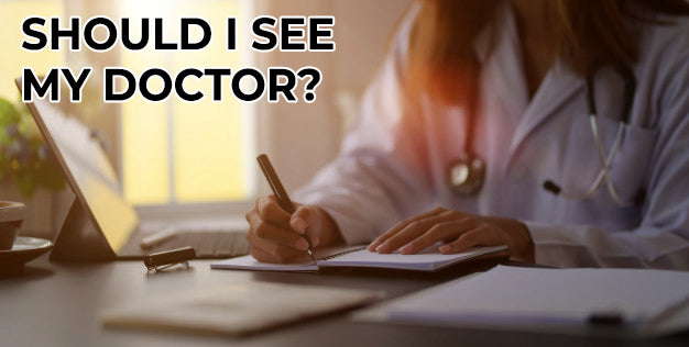 Doctor writing in notebook