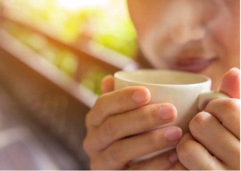 Woman enjoying a cup of coffee