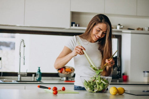 Woman preparing a salad.